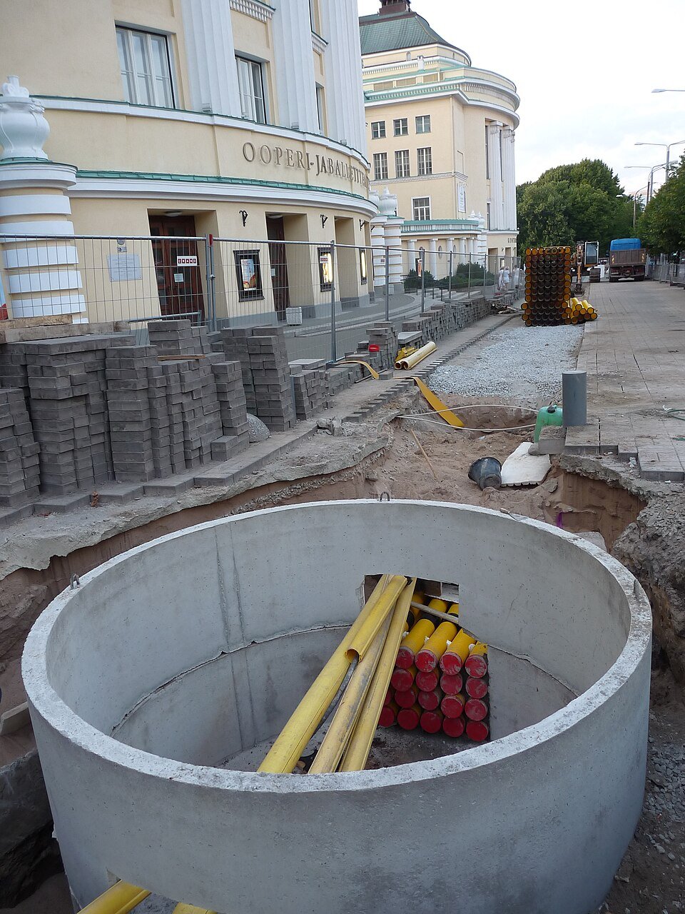 Cable routing under interlock paving